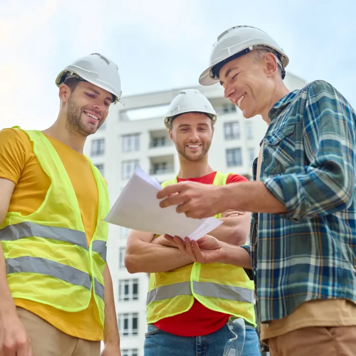 Three men having a deal with the contactor, carpenter and the client.